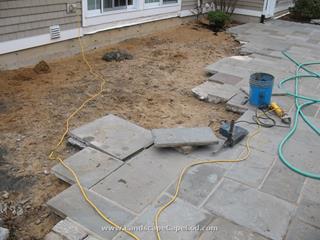Bluestone patio reinstalled after foundation repair