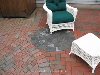 Thinking of having a backyard party, but don't have a good outdoor space where guests can congregate? Then have M. L. Enterprises build a patio—complete with a handsome fire-pit! 
