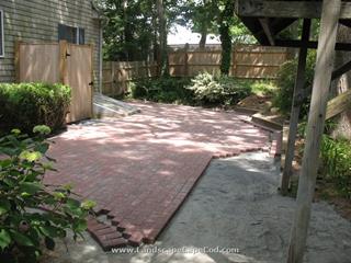 Backyard red brick patio construction