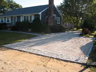 Cobblestone edging and apron with shell driveway