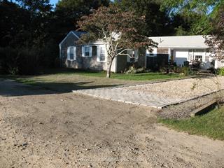Cobblestone edging and apron with shell driveway
