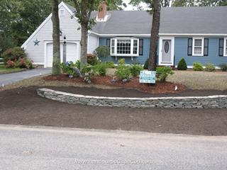 Curved flat stone wall and lawn renovation in Yarmouth Port