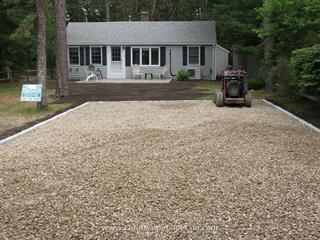 New driveway, lawn renovation and replacement of old brick patio with a new Belgard paver patio installation.