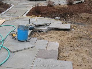 Bluestone patio reinstalled after foundation repair